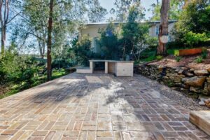 Retaining Wall surrounding paved entertaining area