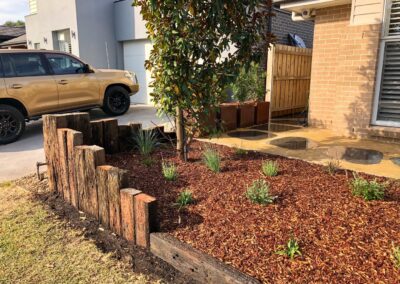Cranebrook – Bluestone steppers, recycled sleepers and stone cladding letterbox
