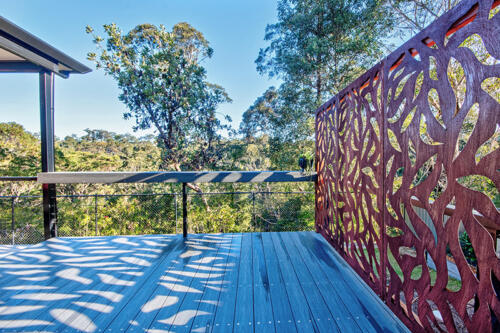 Ekodeck deck with corten steel screen looking out to bushland