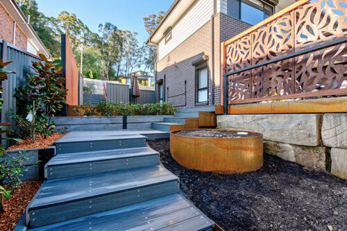Ekodeck custom stairs with corten steel planters and decorative screens