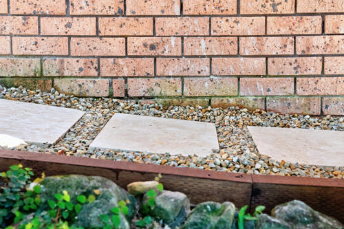 Large paved stepping stones with pebble surrounds