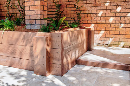 Timber retaining wall raised planter bed