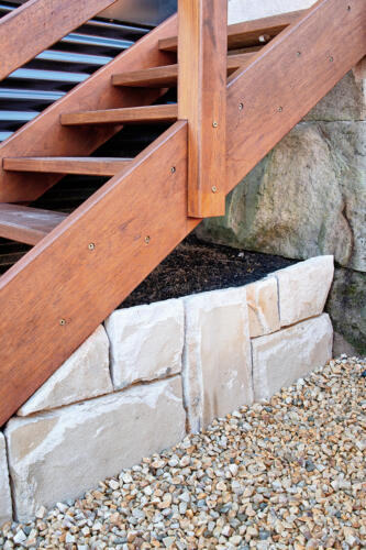 Timber stairs over sandstone edged planter box