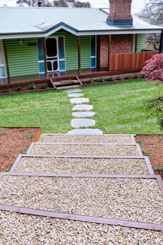 Crushed pebbles stairs and bluestone stepper path