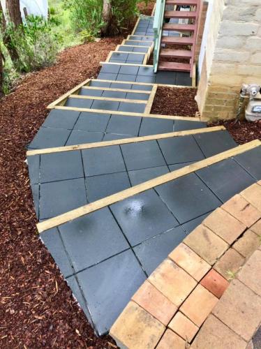 Curved paved garden stairs