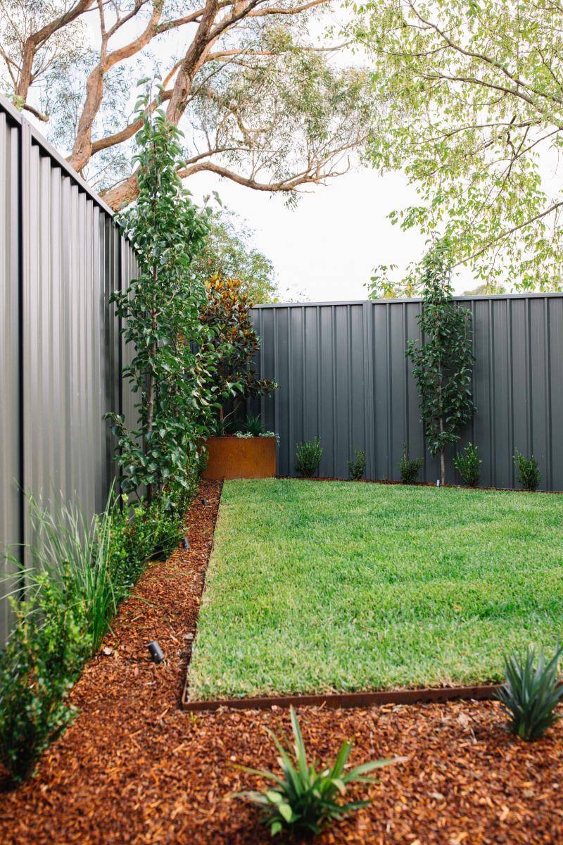 backyard lawn and mulched garden beds 