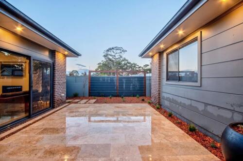 Valo travertine paved courtyard space